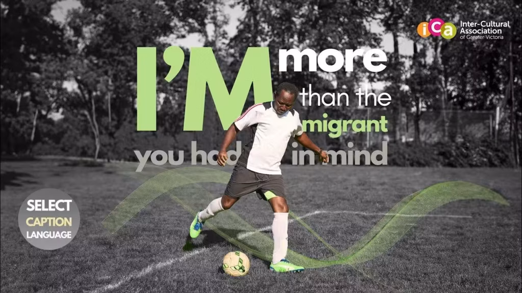 A Black man in athletic wear kicks a soccer ball on a grassy field with text overlay that says "I'm more than the immigrant you had in mind"