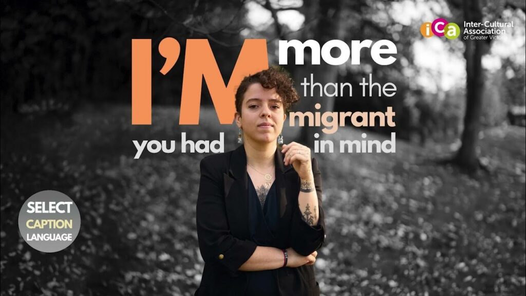 A person with curly hair and tattoos is shown in front of text that reads "I'm more than the immigrant you had in mind.