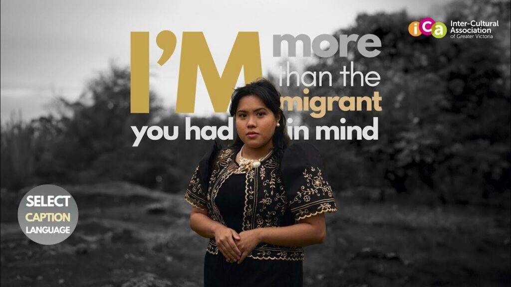 A woman in traditional clothing poses in front of text reading "I'm more than the immigrant you had in mind".