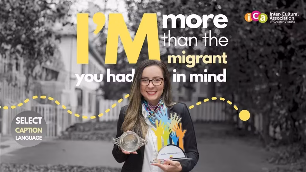 Woman with glasses smiles holding two awards, with text overlay "I'm more than the immigrant you had in mind".